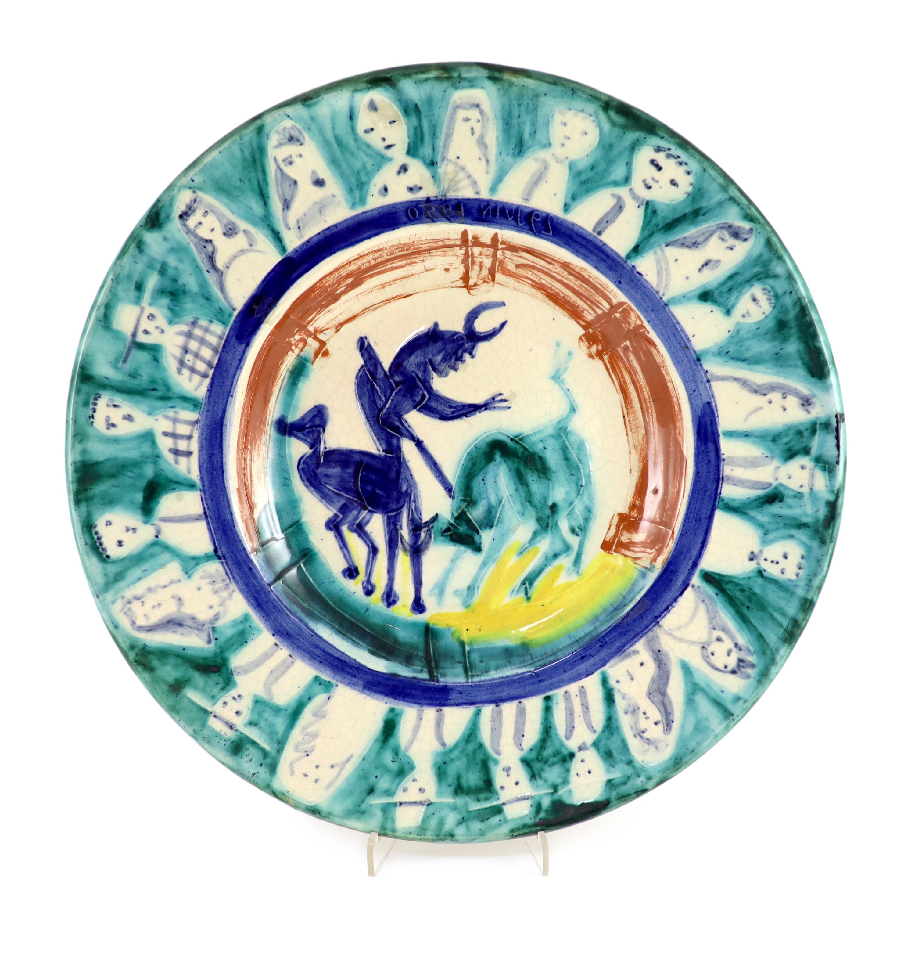 Pablo Picasso (Spanish 1881-1973) for Madoura pottery, a Corrida aux Personnages charger (A.R.104), designed 1950, the rare reverse painted with a faun holding a branch, signed and inscribed ‘Picasso, 1st Septembre 1951’